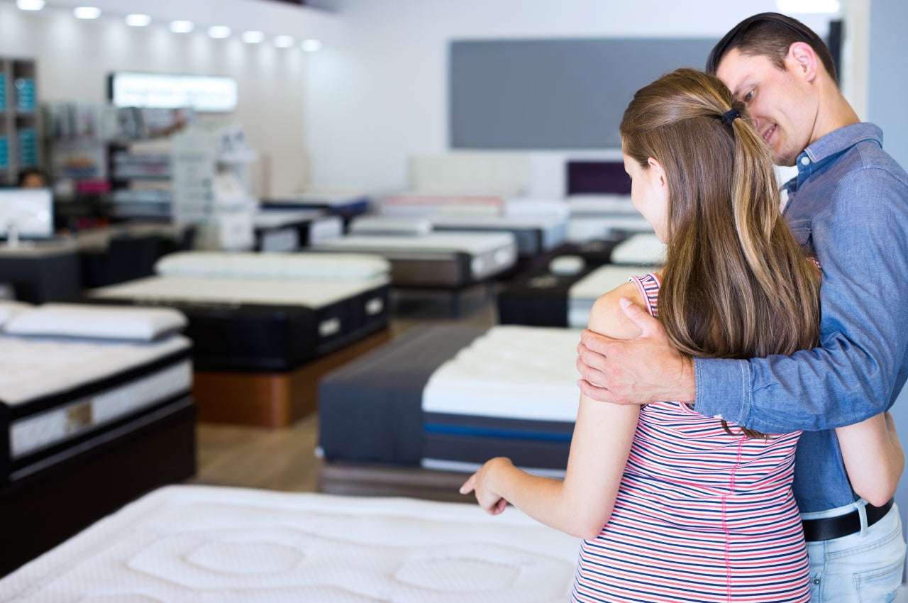 Couple choosing a mattress