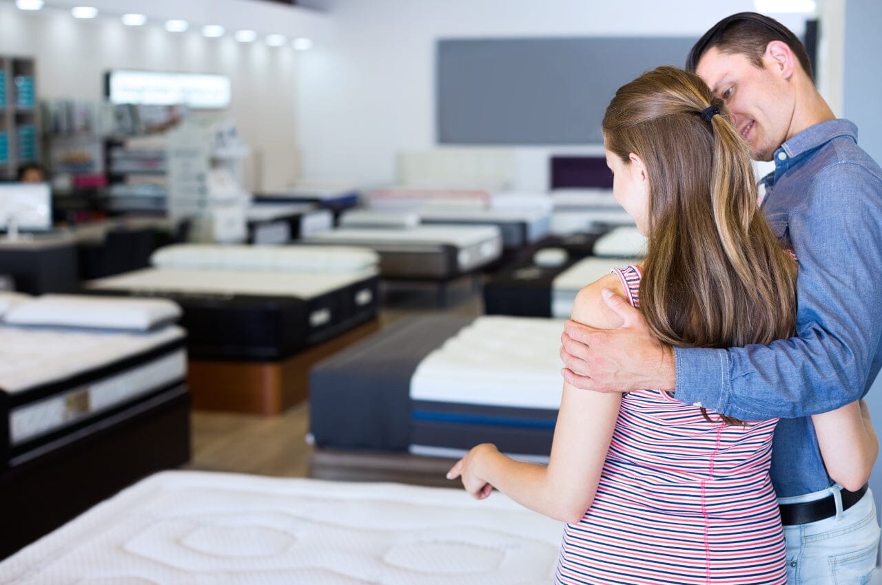Couple choosing a mattress