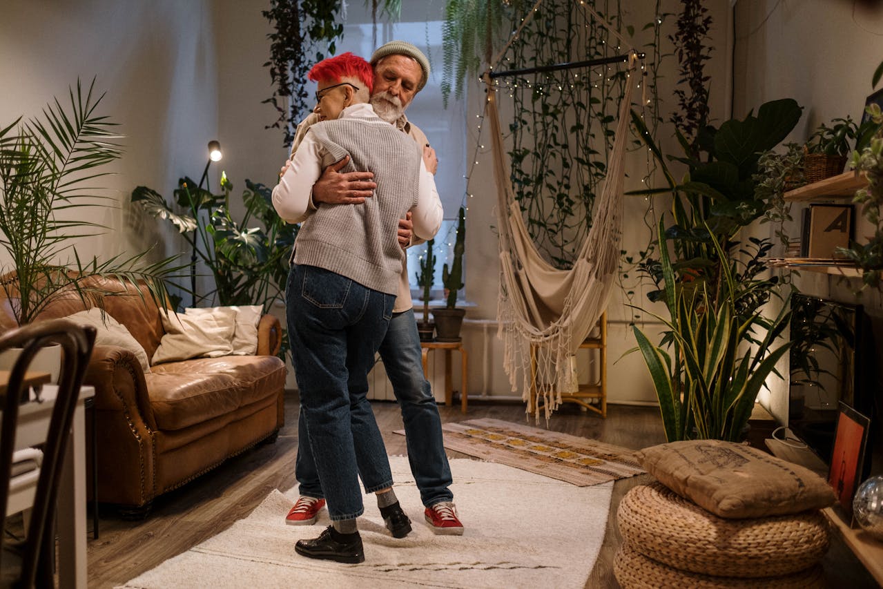 Elderly Couple Dancing in Their Bohemian Living Room