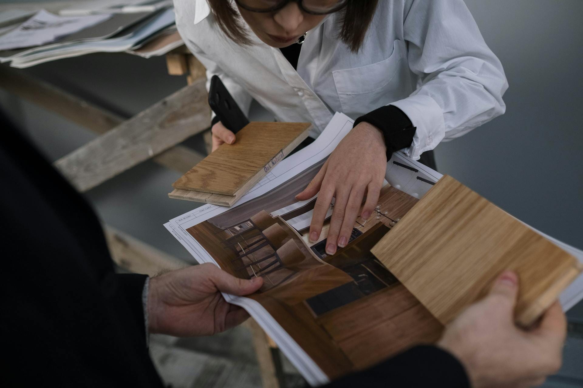People checking wood samples for built-in cabinetry