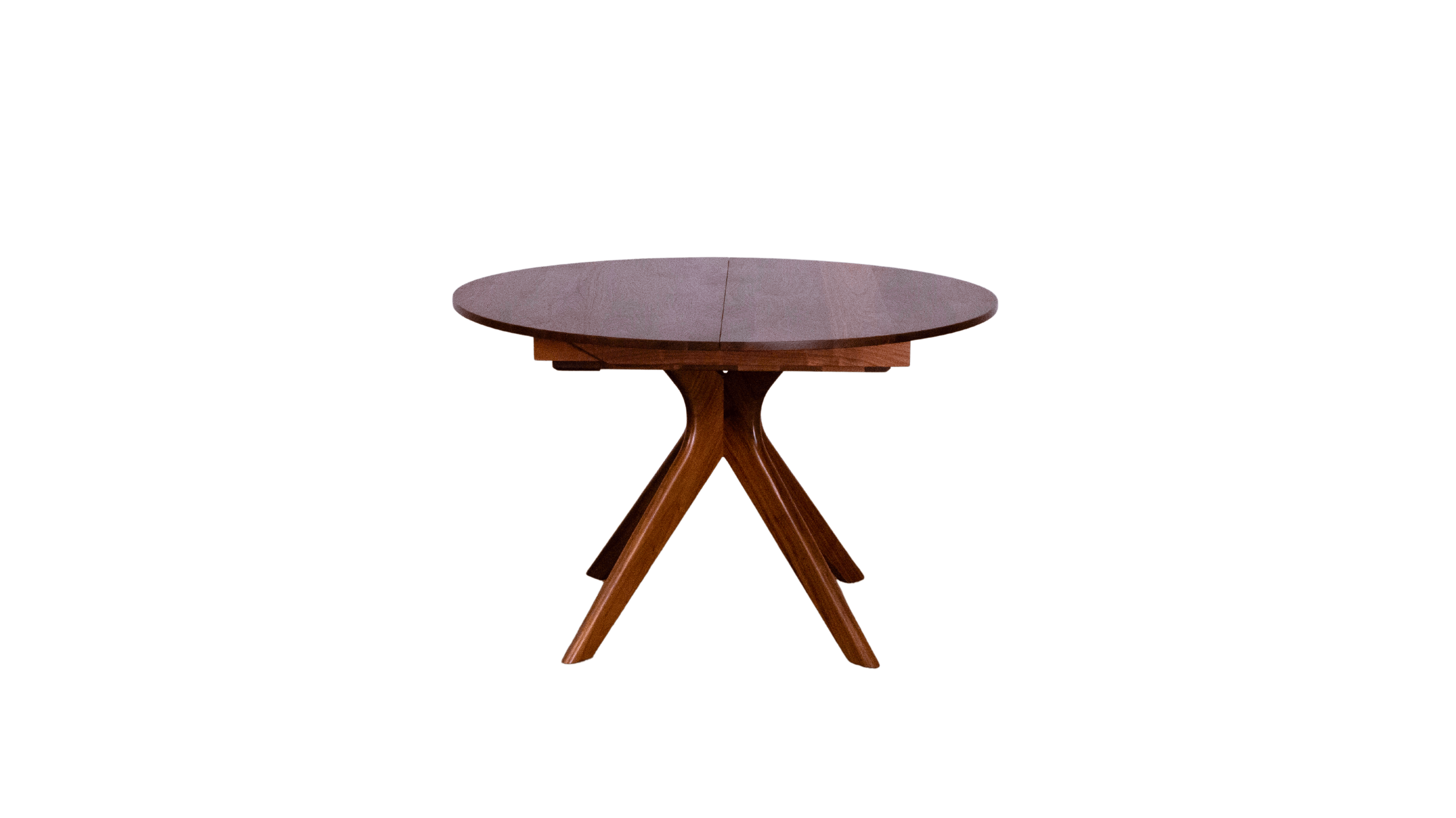 The Strata Extendable Round Dining Dinette Table by TY Fine Furniture features a smooth dark brown solid wood top and three angled legs, shown here against a plain white background.