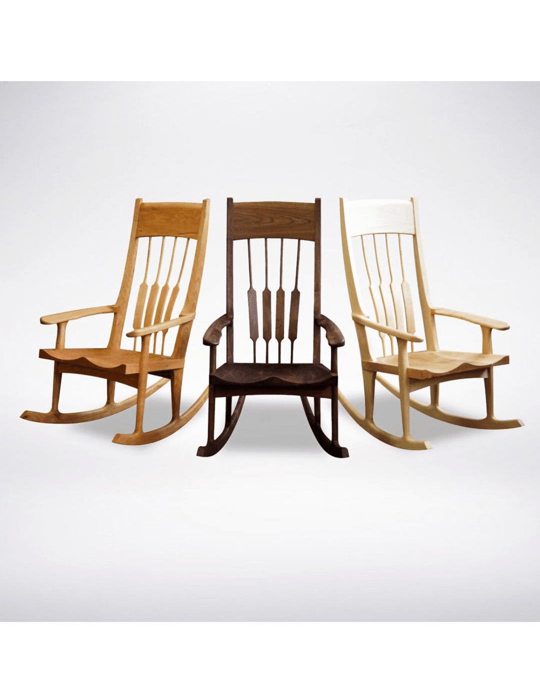 Three TY Fine Furniture Sunrise Rocking Chairs—Solid Wood, handcrafted in Columbus OH—are shown side by side with finishes in light, medium, and dark wood, highlighting solid wood craftsmanship against a white background.