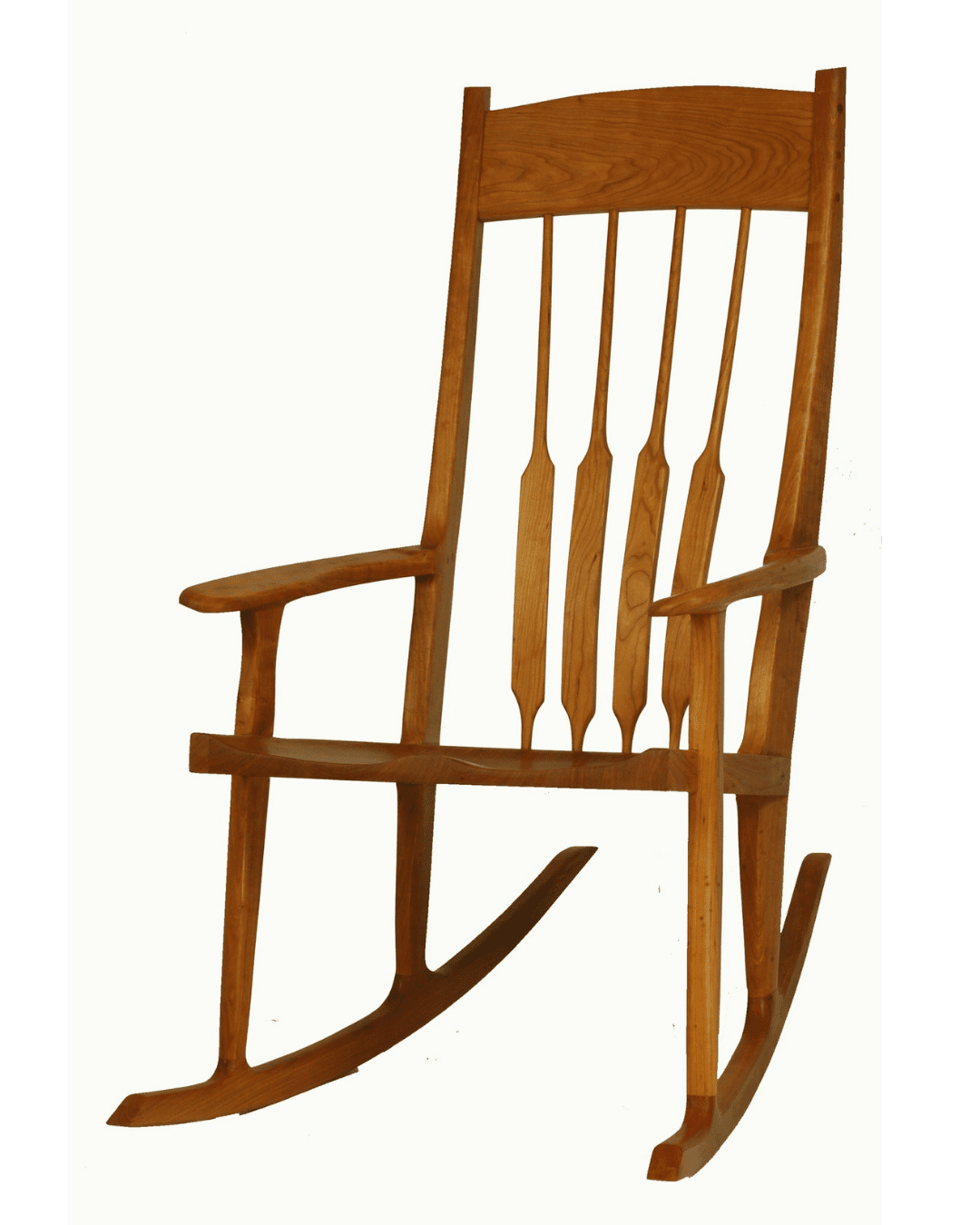 The Sunrise Rocking Chair - Solid Wood by TY Fine Furniture features vertical backrest slats, curved armrests, and dual curved rockers, displayed against a plain white background. Available in Columbus, OH.
