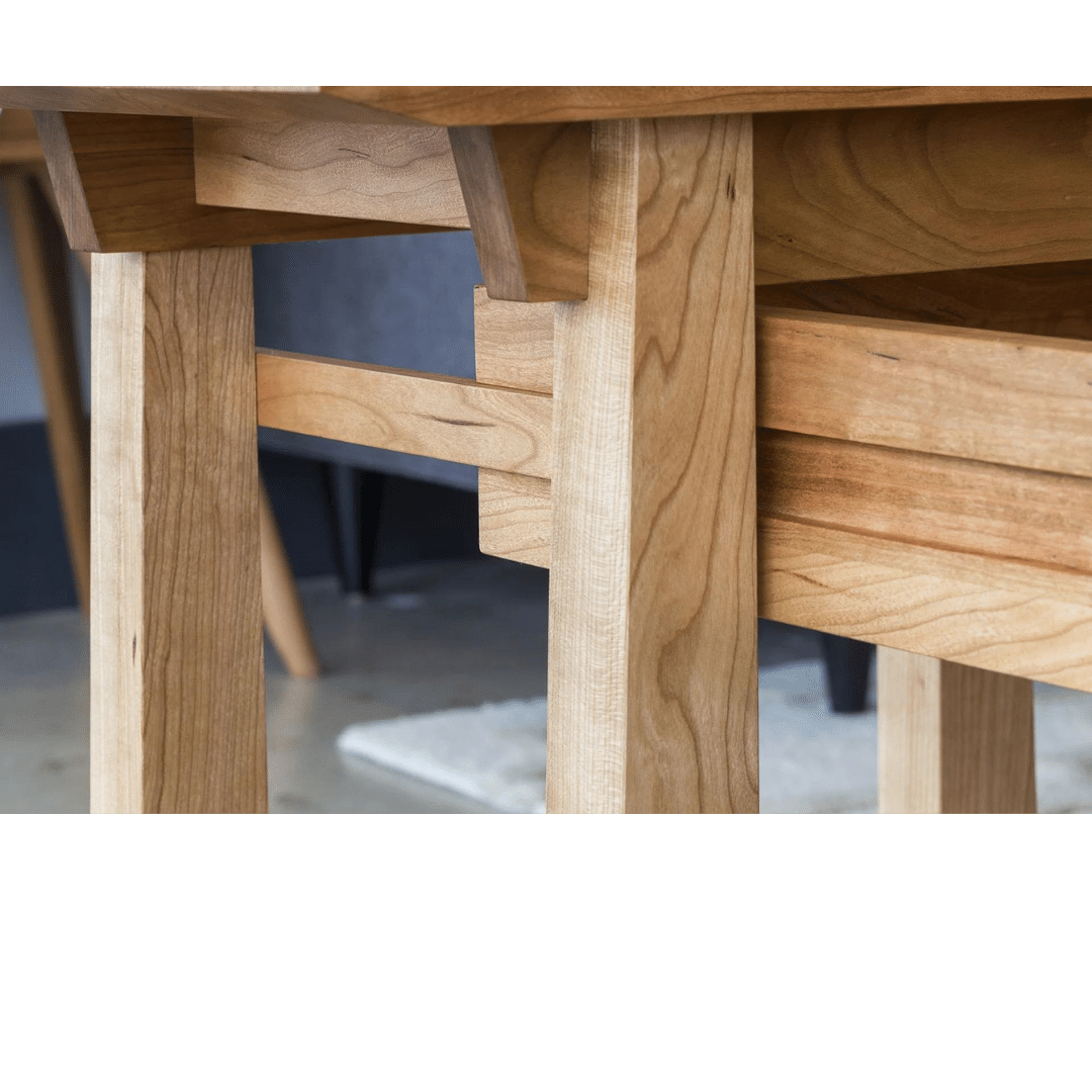 Close-up of the Enso Side Table With Drawer by TY Fine Furniture, featuring smooth, light-colored solid wood with visible grain and precise handmade joinery—an elegant example of organic craftsmanship.