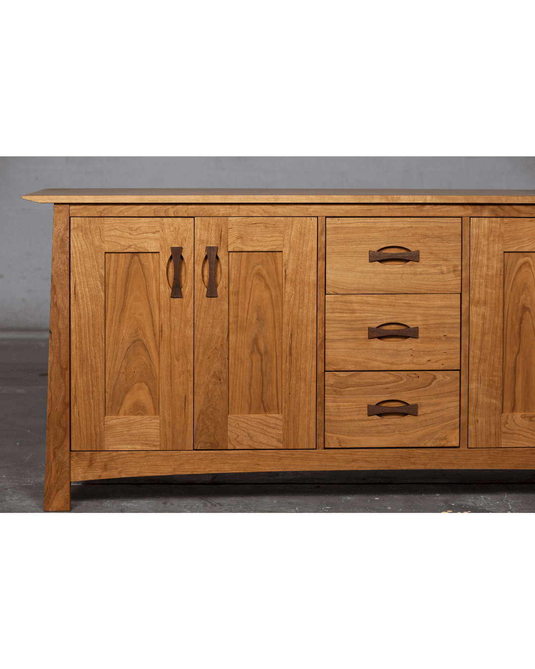 The Enso Solid Wood Buffet by TY Fine Furniture features two left cabinet doors and three right pull-out drawers in a light brown finish—ideal for stylish dining room storage. Available in Columbus, OH.