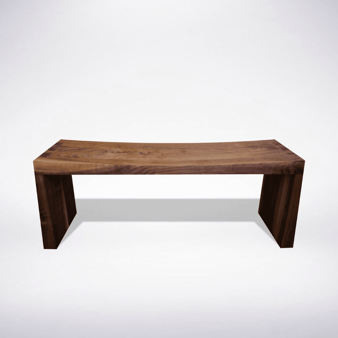 The Enso Solid Wood Bench by TY Fine Furniture, handcrafted in Columbus, Ohio with a curved seat and rectangular legs inspired by Japanese woodworking, is shown against a plain white background.
