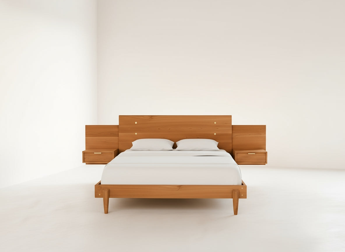A minimalist bedroom featuring the Apollo Platform Bed with Integrated Tables in cherry by TY Fine Furniture, paired with crisp white bedding, set against plain white walls and floors.