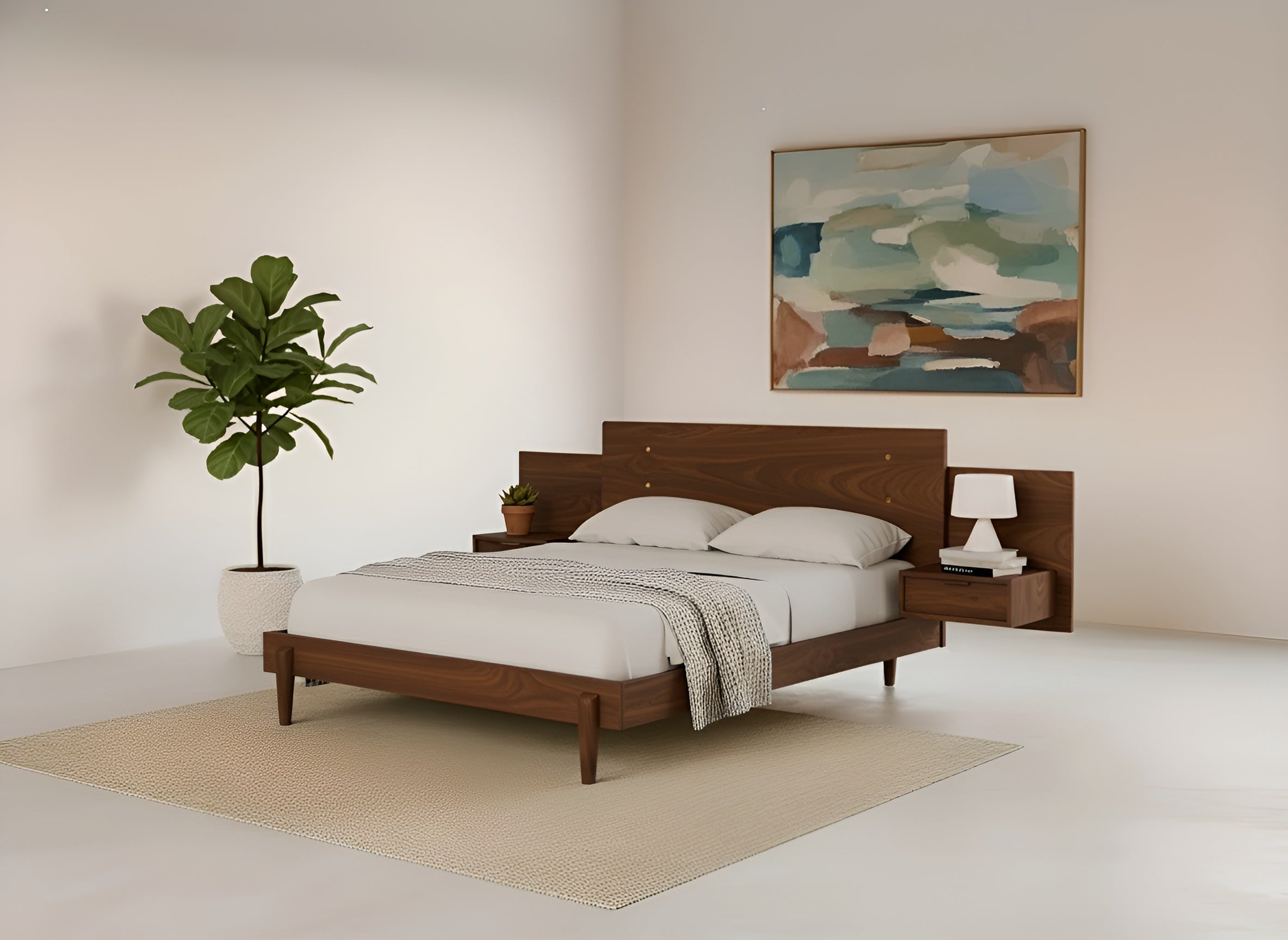 A modern bedroom features the Apollo Platform Bed with Integrated Tables in Walnut by TY Fine Furniture, dressed in white bedding and a beige throw. A lamp, plant, abstract painting, potted plant, and neutral rug create a serene atmosphere.