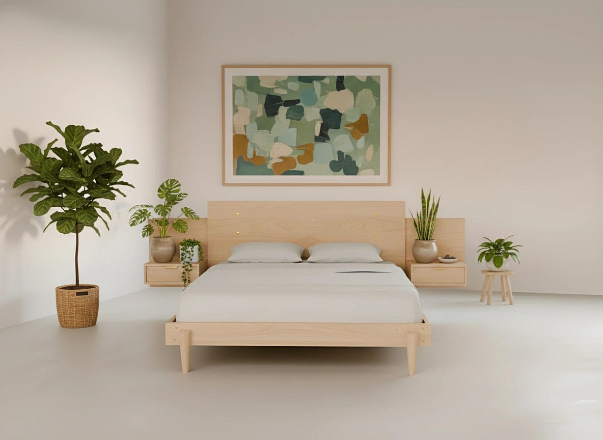 A minimalist bedroom featuring the TY Fine Furniture Apollo Platform Bed with Integrated Tables in maple, two white pillows, abstract green artwork above the bed, potted plants on each side, and light walls and floor.