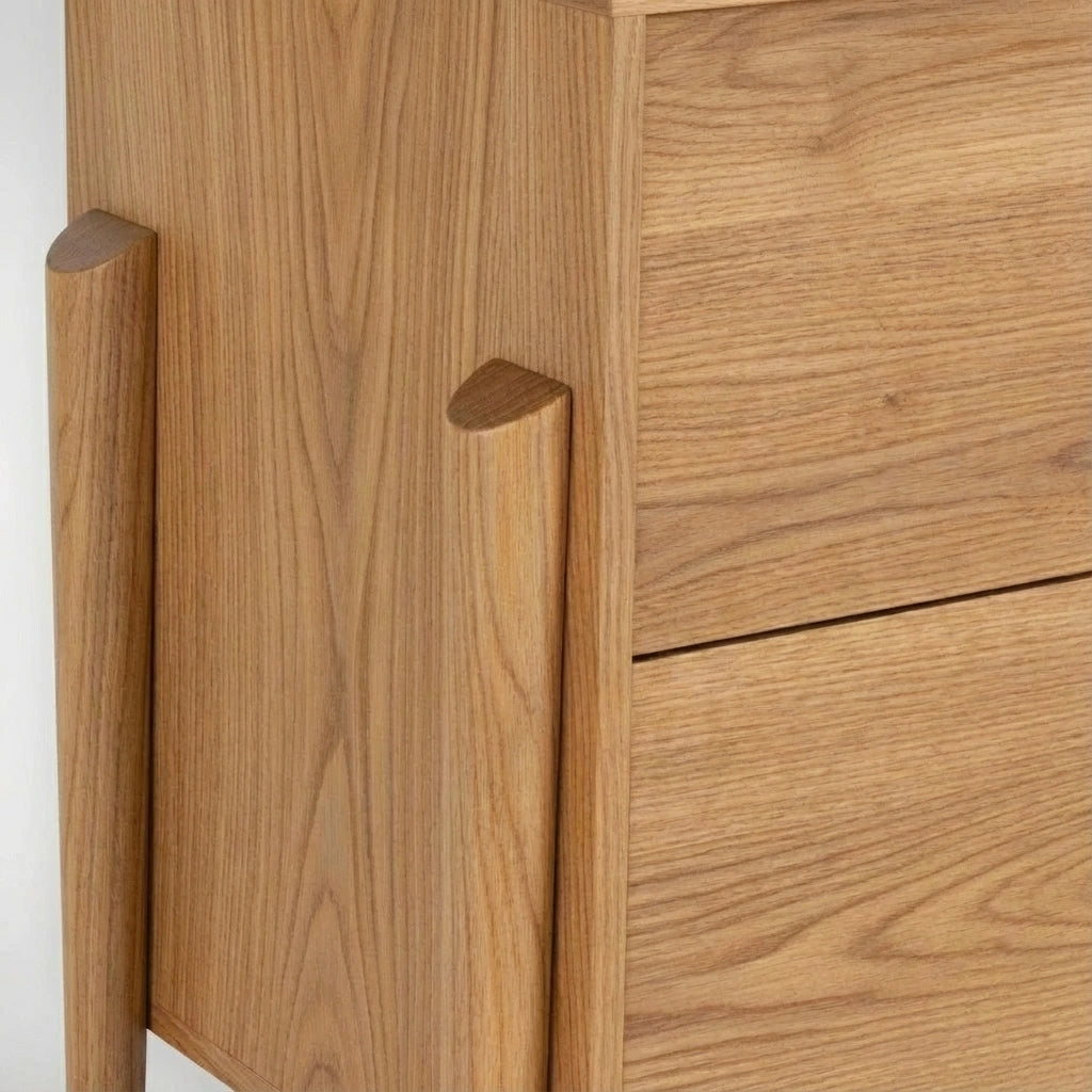 Close-up of the Apollo 6 Drawer Dresser by TY Fine Furniture, a handcrafted mid-century modern white oak piece with visible wood grain and smooth, rounded vertical handles.