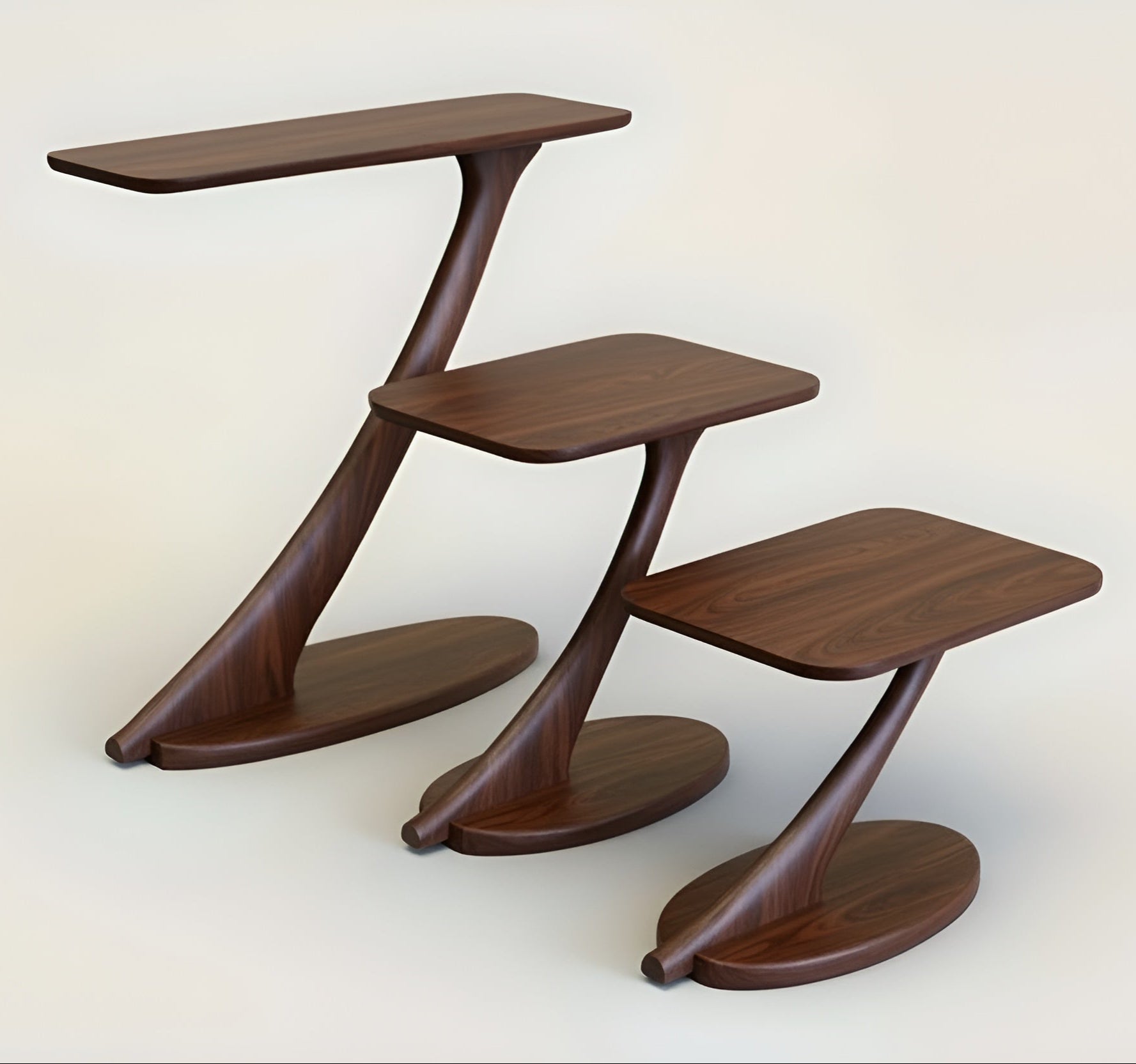 Three Cantilever Side Tables by TY Fine Furniture, handmade from solid walnut, feature a unique Z-shaped design and oval bases, arranged in descending height against a neutral background.