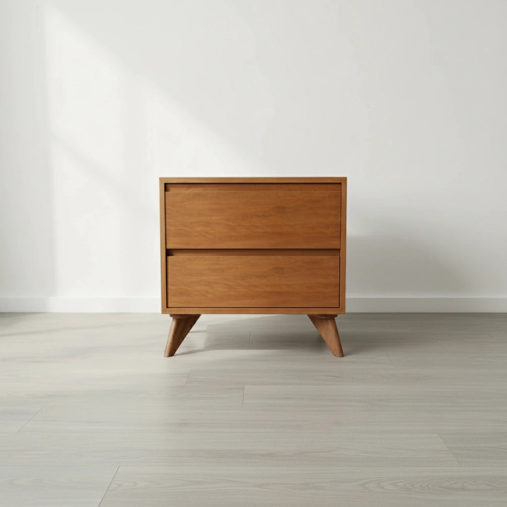 The Modern Cube Side Table - Cherry by TY Fine Furniture, crafted from solid wood with Italian push-to-open slides, stands against a white wall on a light wood floor as soft natural light casts gentle shadows.
