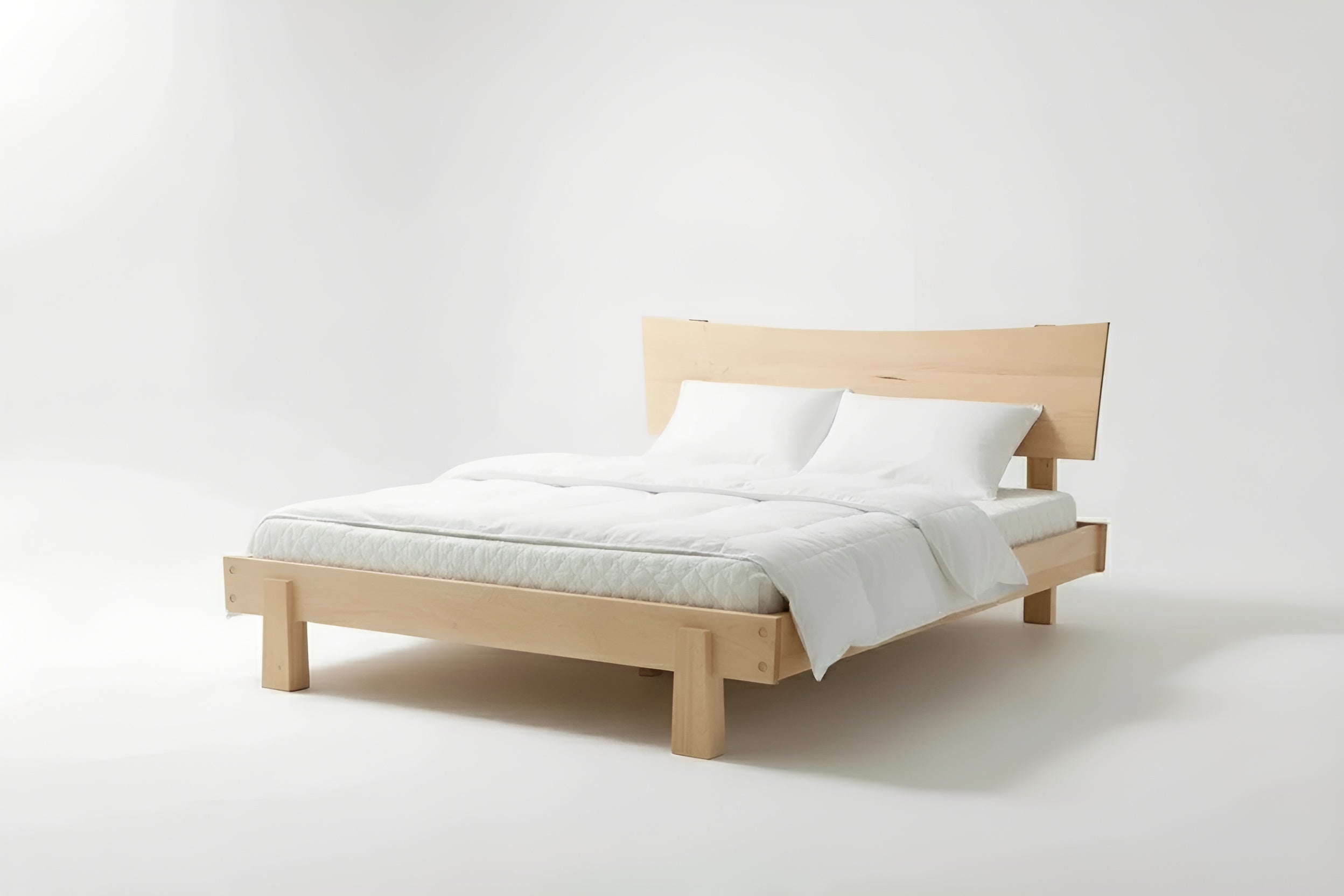 Side view of the Horizon Platform Bed in solid wood maple, inside a bedroom with Japandi aesthetic. This bed frame is made in USA.