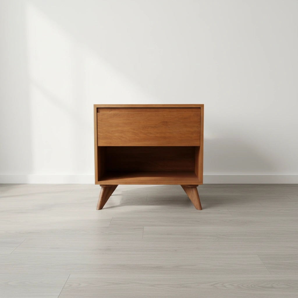 The Modern Cube Side Table - Cherry by TY Fine Furniture features a mid-century modern design with angled legs, a solid wood cherry frame, an Italian push-to-open drawer, and open storage space, shown on light wood flooring against a white wall.