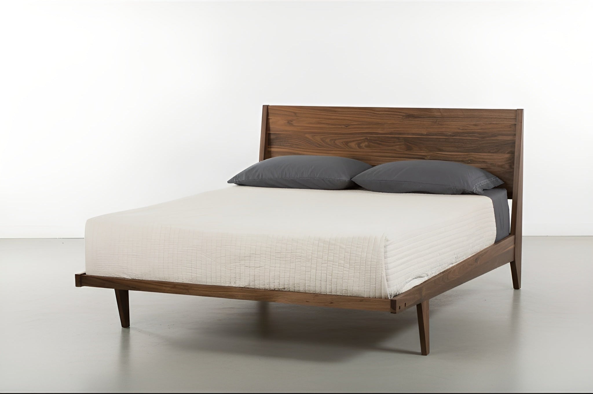 Front view of the Modern ONE Platform Bed in solid wood walnut, made in the USA using natural hardwood, by T.Y. Fine Furniture.