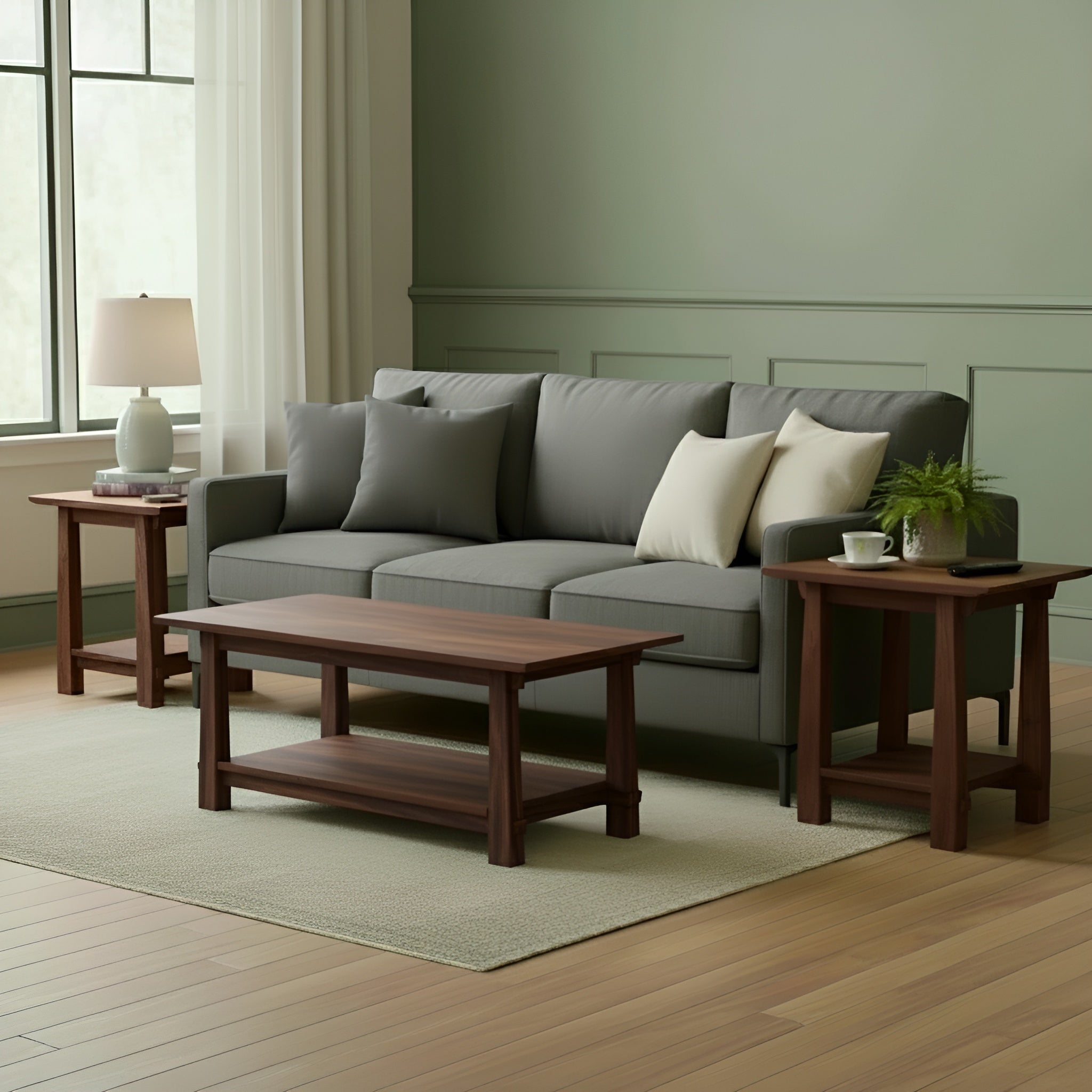 A living room features a gray sofa with two white and one gray pillow, a wooden coffee table, TY Fine Furniture’s Horizon Side Table Solid Wood - Walnut, a lamp, potted plant, and white-curtained window. Green walls and wood floors evoke calm Japanese style.