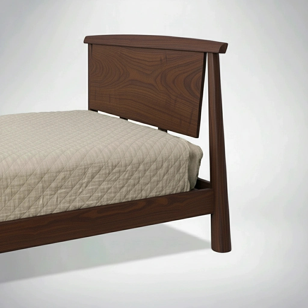 A partial view of the TY Fine Furniture Sunrise Platform Bed - Walnut, with a dark brown headboard and frame and a beige quilted mattress, set against a plain light background.