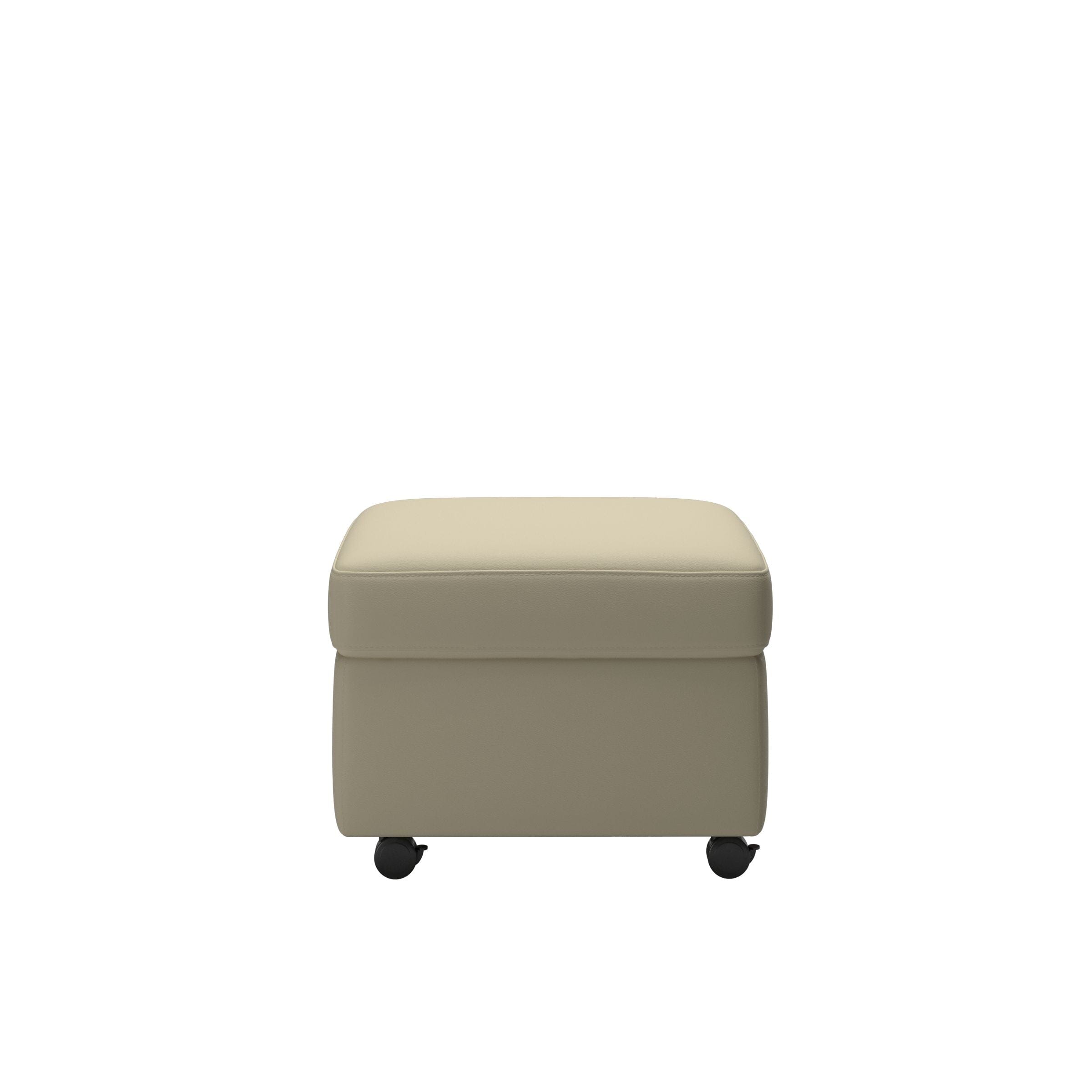 The Stressless Single Ottoman by Stressless is a beige, rectangular coffee table, footrest, and ottoman with smooth upholstery and four black wheels, ideal for living room storage; shown against a white background.