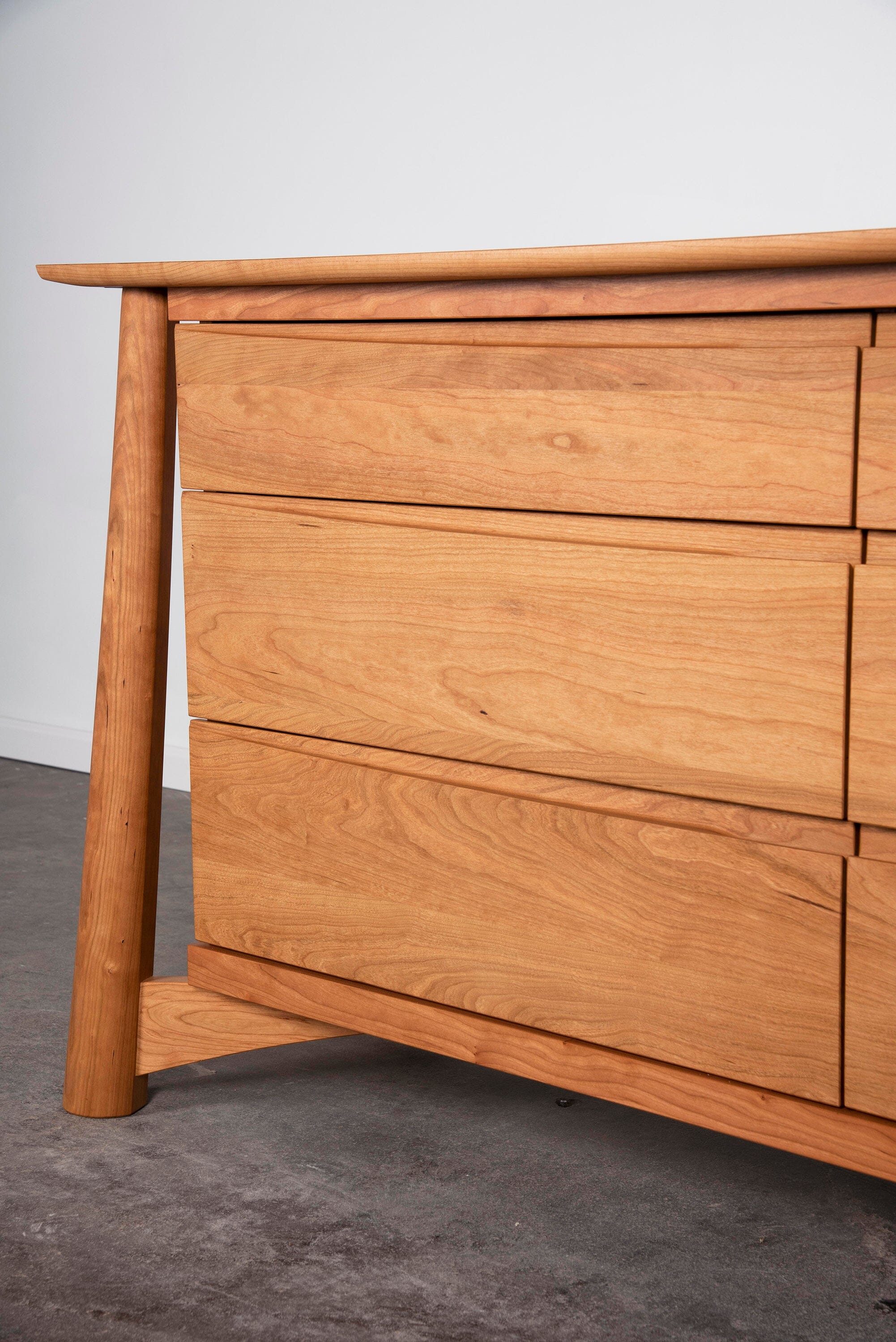 Sunrise Dresser in Cherry, featuring six drawers in close-up. It's made in USA, using natural solid wood.