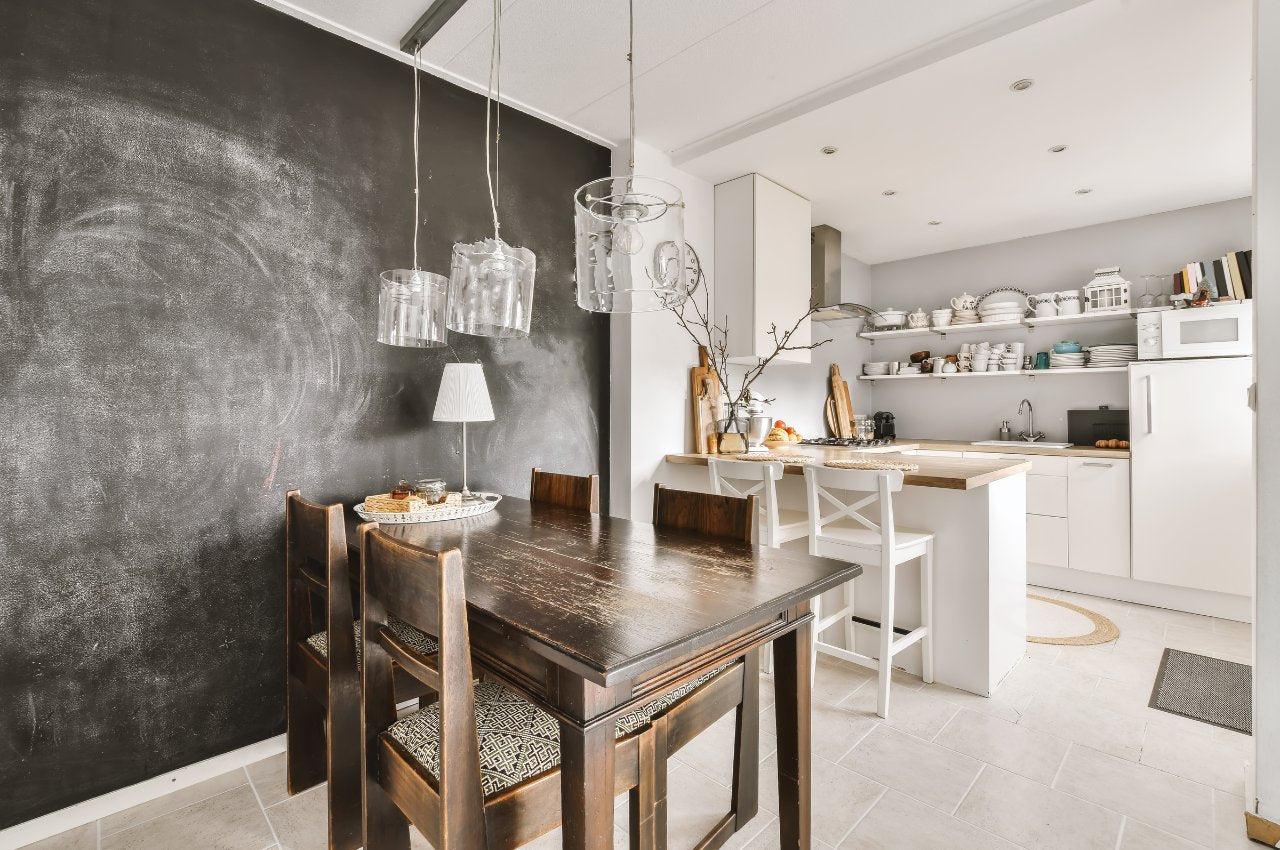 Dark wood dining table and chairs in white kitchen