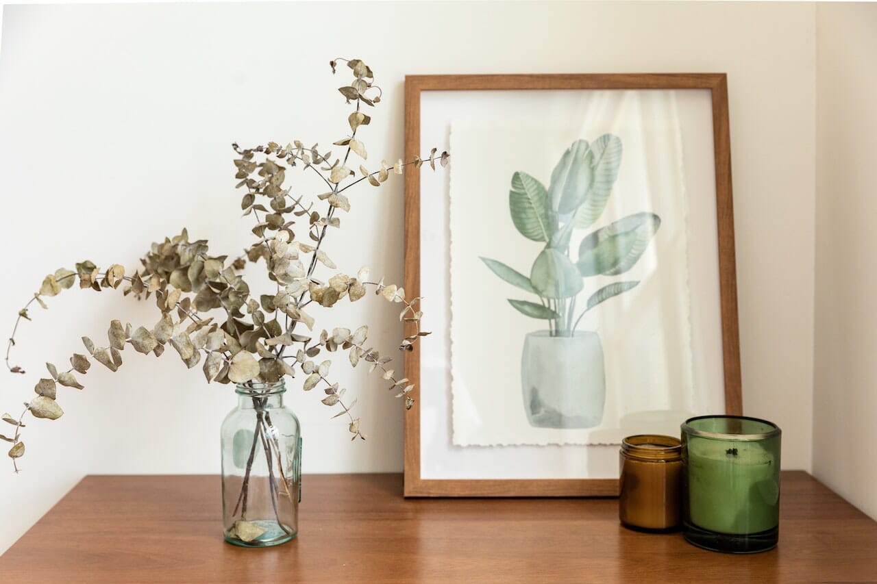 Famed Plant Painting over a Wooden Table