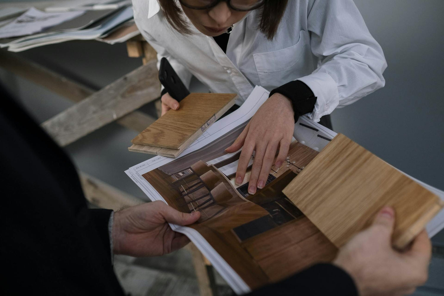 People checking wood samples for built-in cabinetry