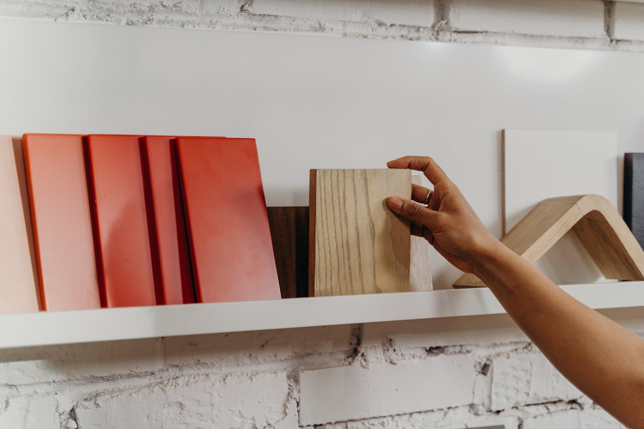 Person holding wood tile