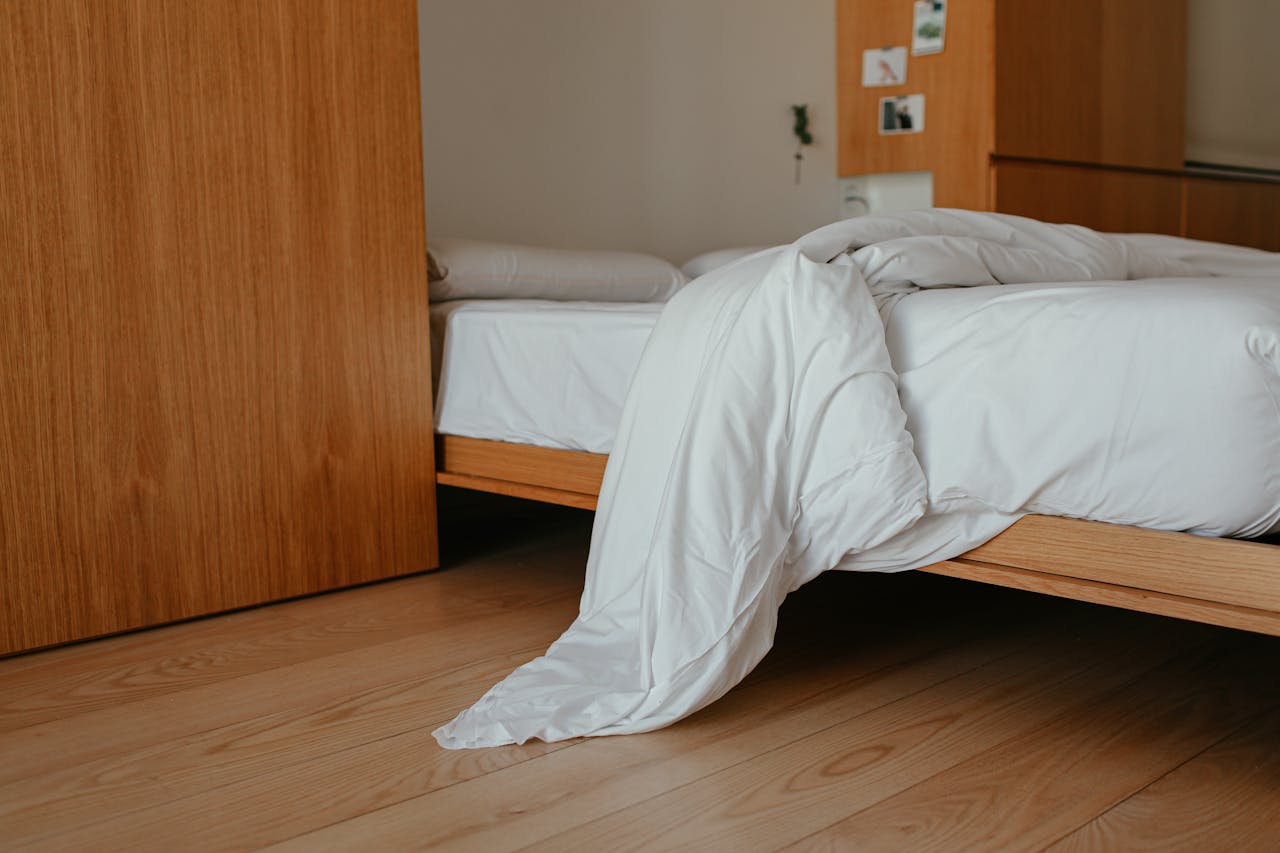 Unmade bed on platform bed