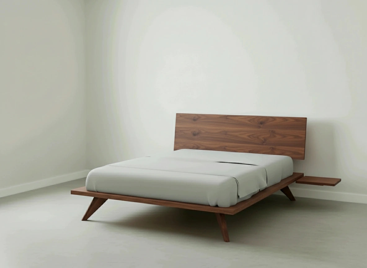 A minimalist bedroom with a mid-century modern wooden bed frame, white bedding, and a built-in side table against a plain white wall.