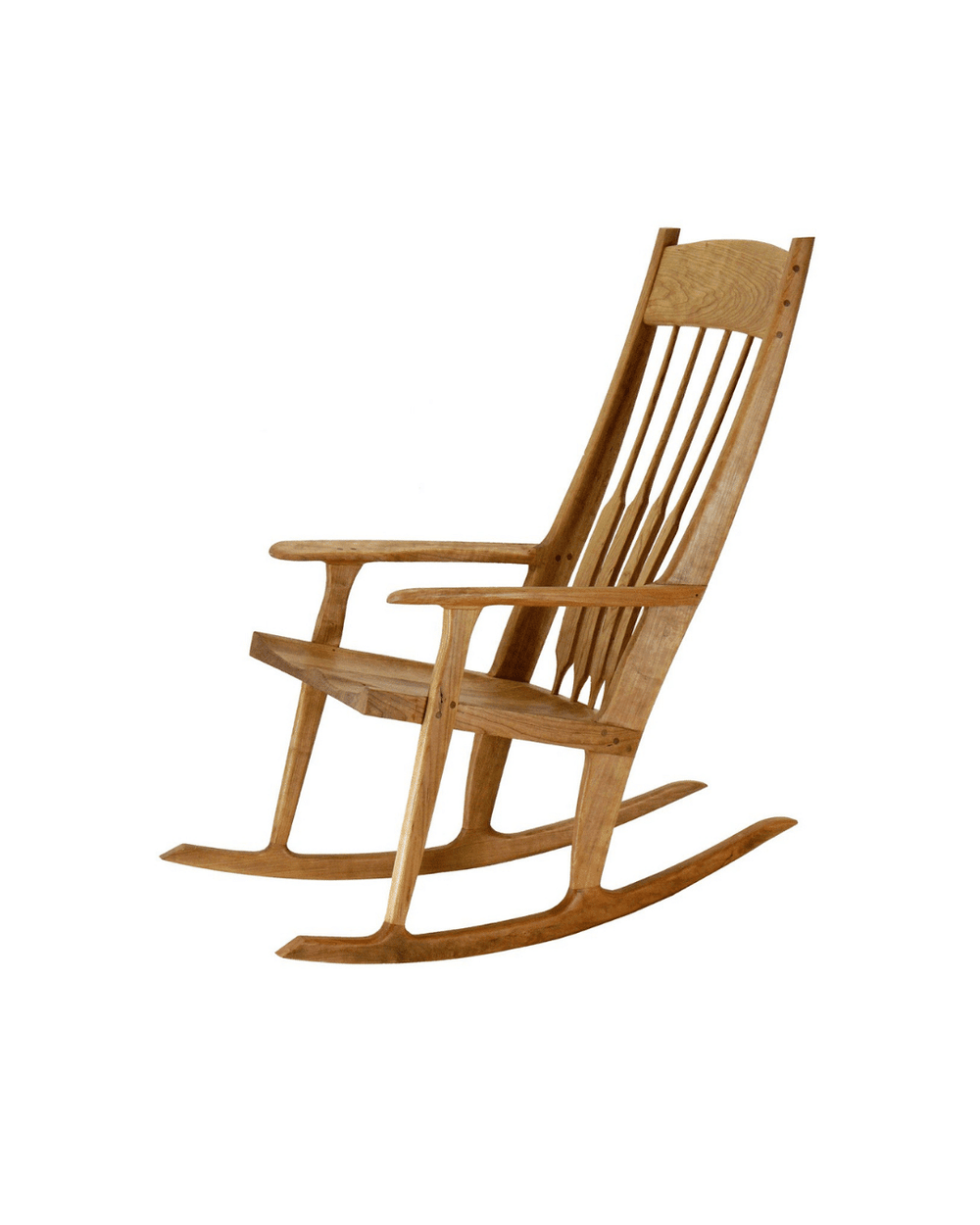 Close-up of a wooden rocking chair in honey maple finish with curved rockers and spindle back.