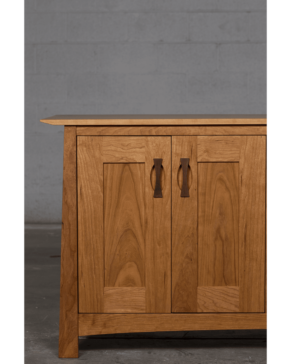A close-up of the cupboards on a wooden sideboard