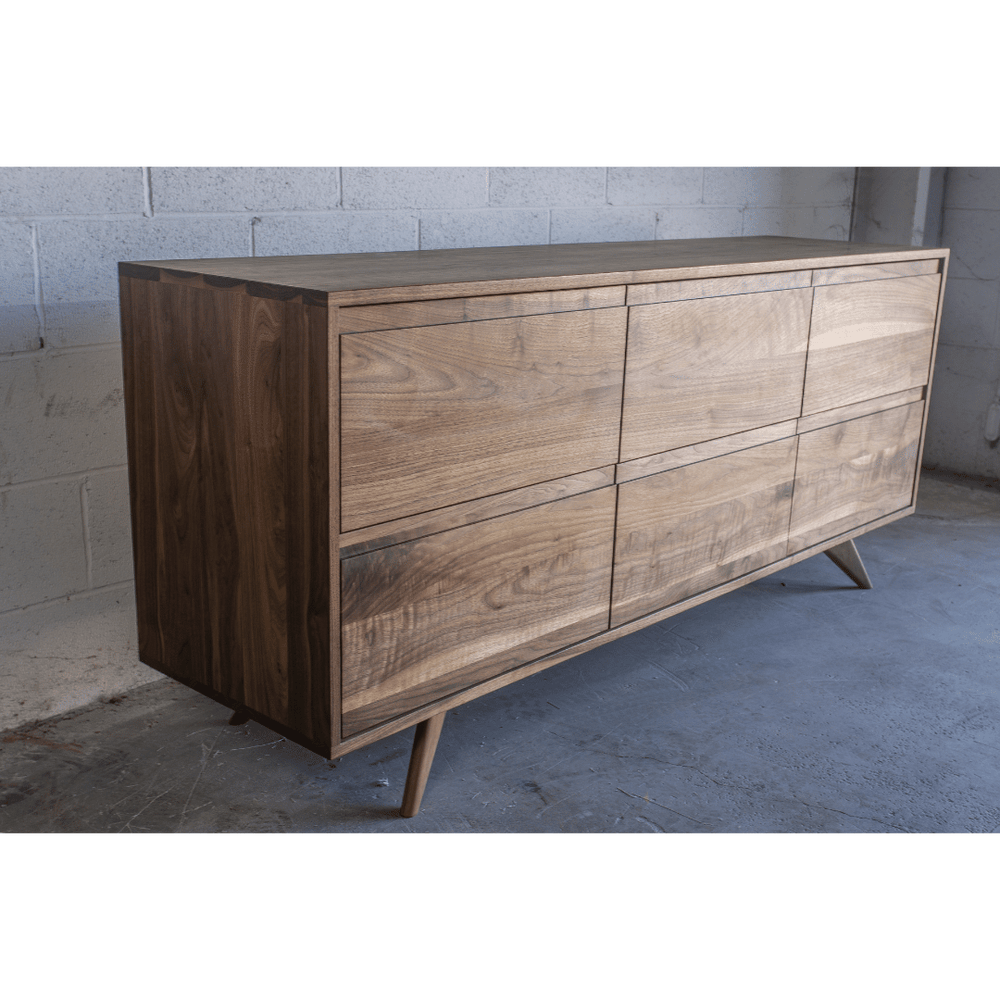 Close-up of the sideboard front showing four panels and grain pattern.