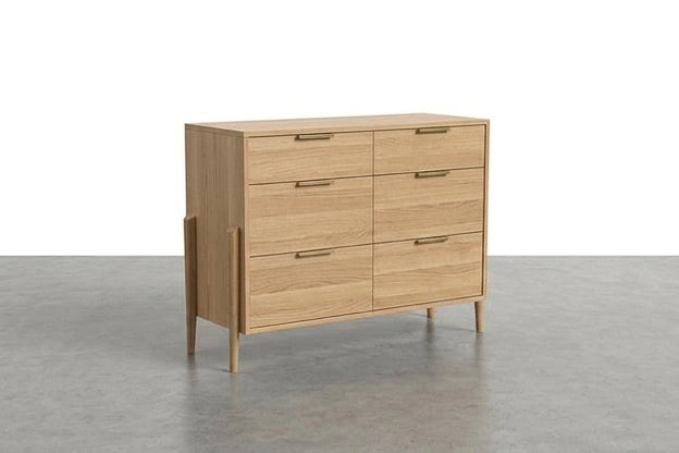 The TY Fine Furniture Solid White Oak 6-Drawer Double Bank Dresser from the Apollo Collection, featuring slim brass handles and four angled legs, is placed on a gray floor against a plain white background.