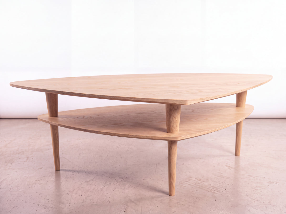 Two-tiered, triangular Solid White Oak Coffee Table - Atomic Collection | TY Fine Furniture, featuring a mid-century design made of solid hardwood with tapered legs.