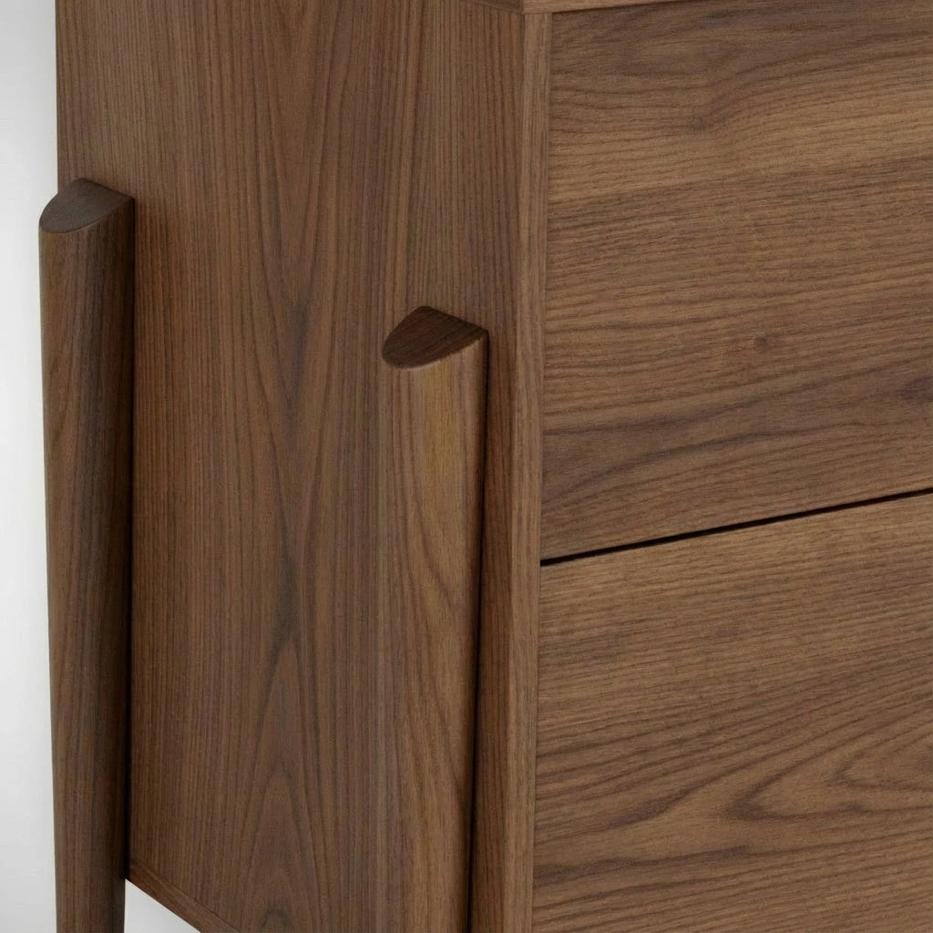 Close-up of TY Fine Furniture's Apollo 6 Drawer Dresser, a handcrafted, Mid-Century Modern walnut piece featuring visible wood grain and smooth finish for natural elegance.