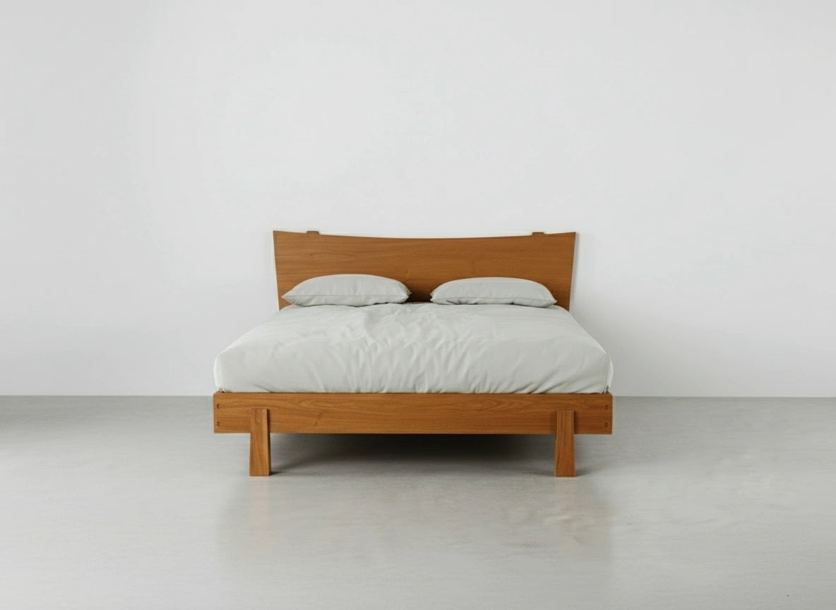 Front view of the Horizon Platform Bed in cherry wood, inside a room with white walls and concrete flooring. Made in the USA using natural hardwood by T.Y. Fine Furniture.