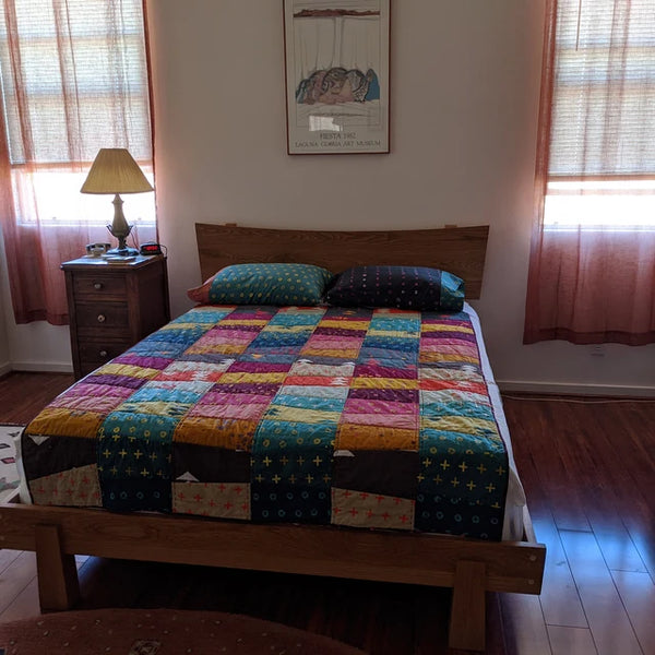 Customer photo of a solid wood bed frame