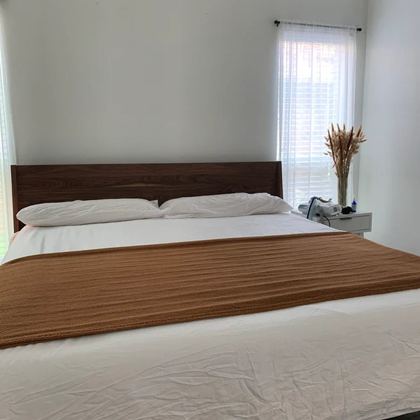 Customer photo of a mid-century modern bed in solid wood