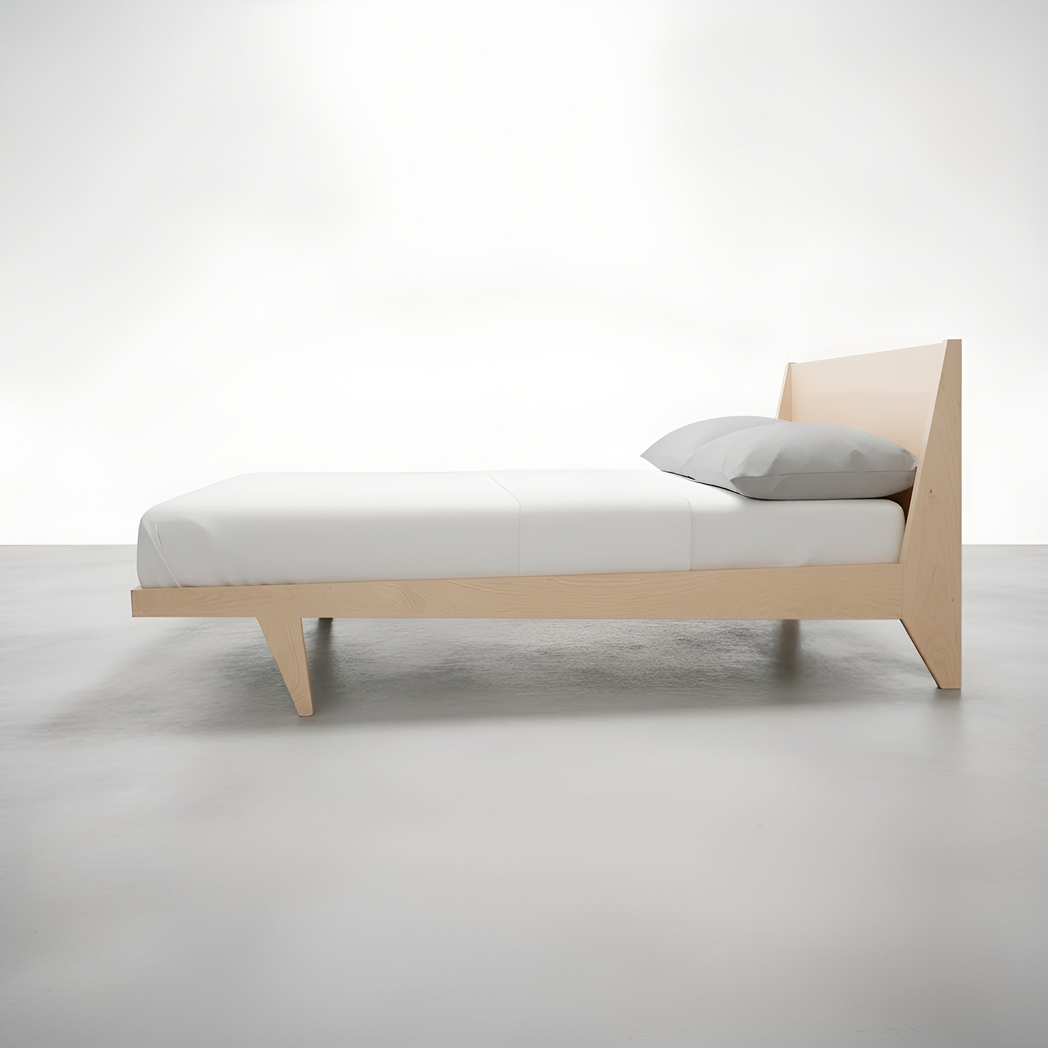 Side view of the Modern ONE Platform Bed and Modern Side Tables in maple, made in the USA using natural hardwood, by T.Y. Fine Furniture. 