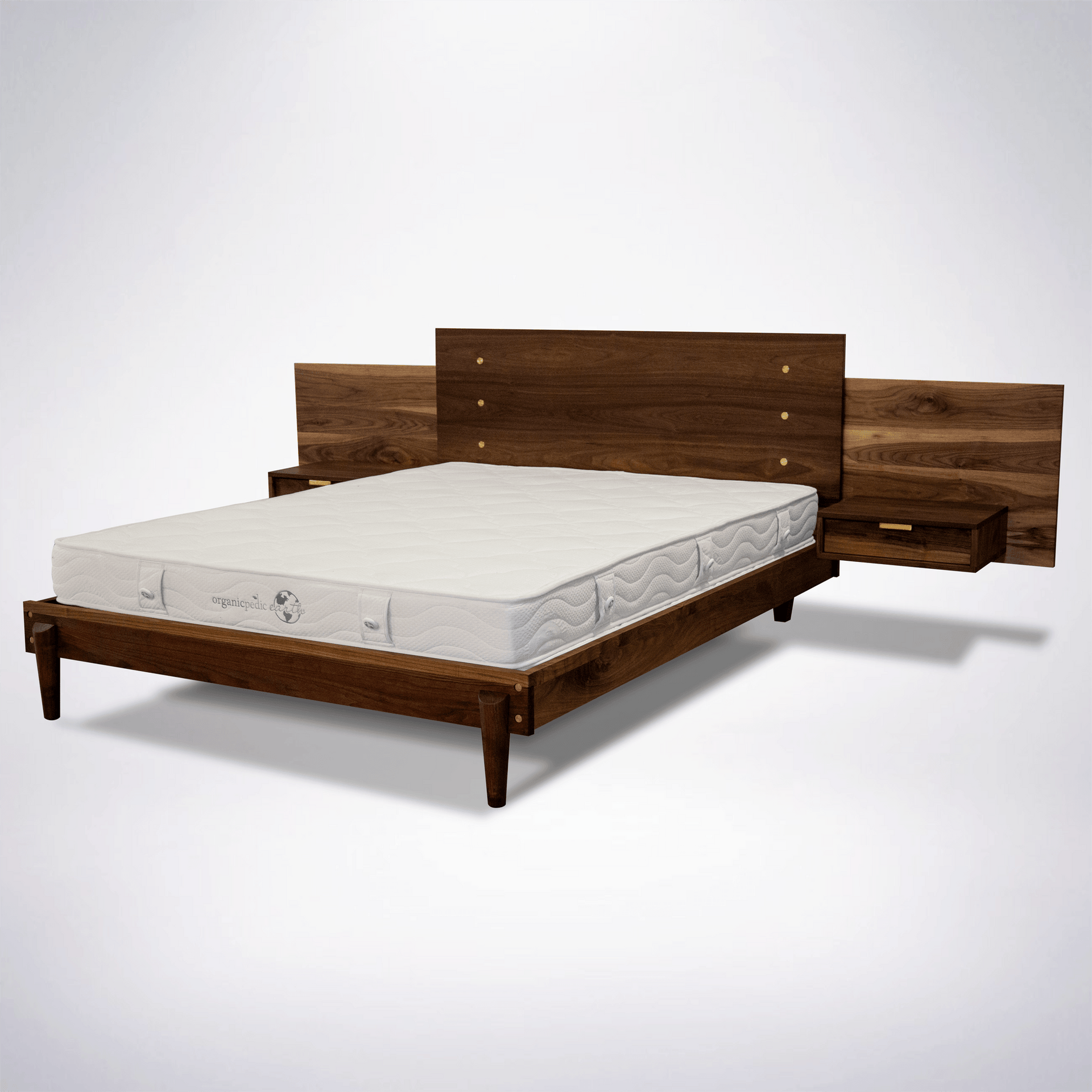 Solid wood bed frame with integrated tables and brass hardware