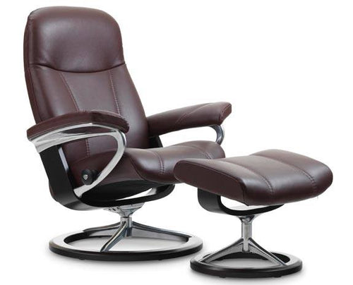 Elegant maroon/burgundy leather lounge chair with matching ottoman on a chrome and dark wood base.