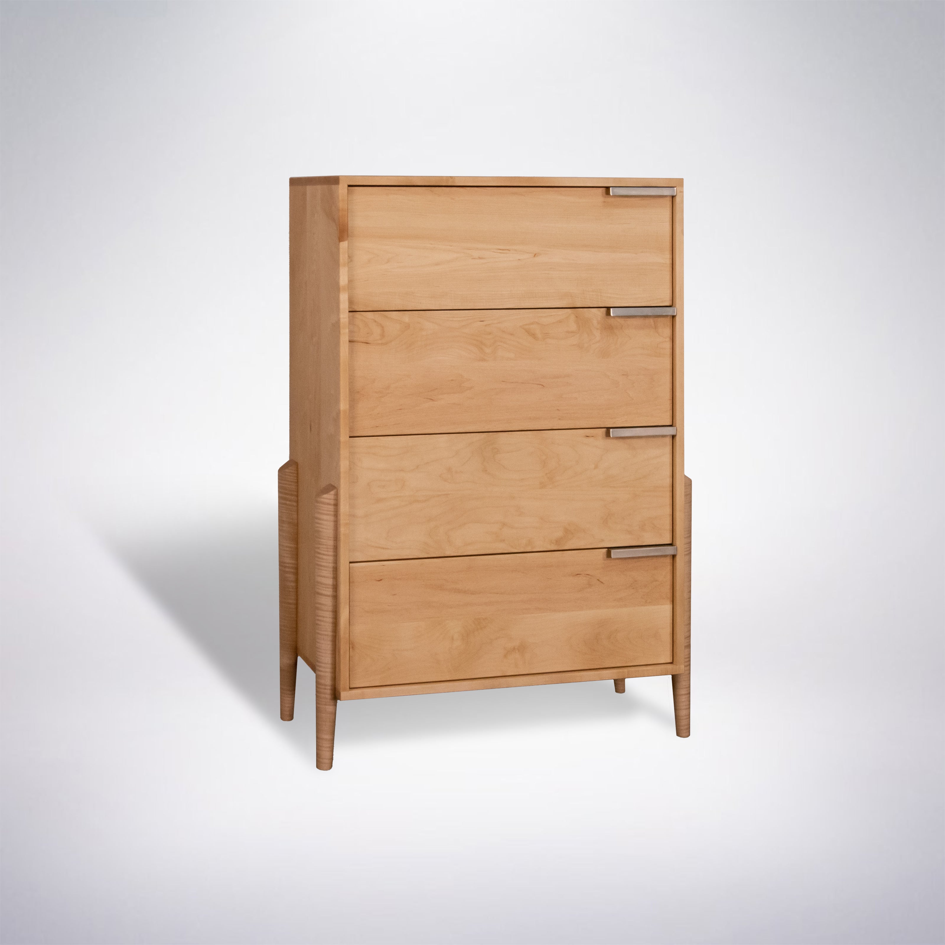 Light wood tall dresser with five drawers and slim legs, mid-century style.