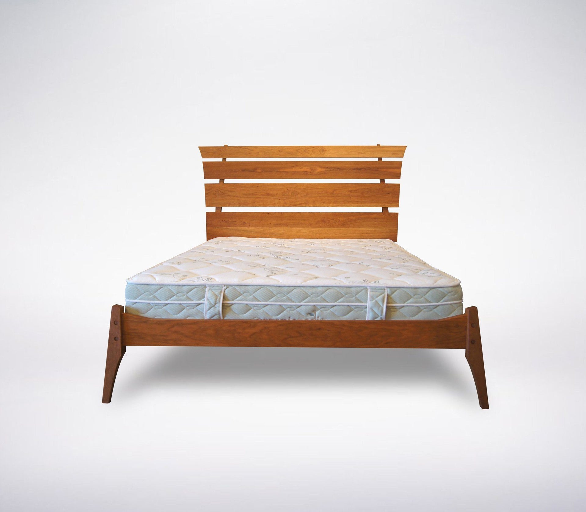 Modern platform bed in front view. Made from natural solid wood and crafted in Columbus, Ohio.