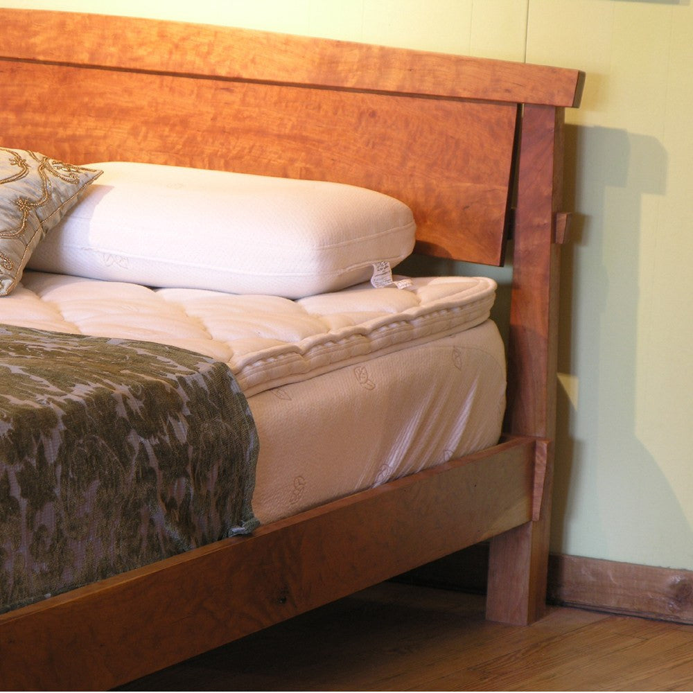 Headboard of an organic bed frame built from natural solid wood